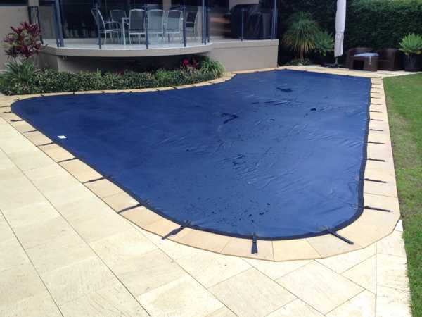 Blue leaf cover on shaped pool