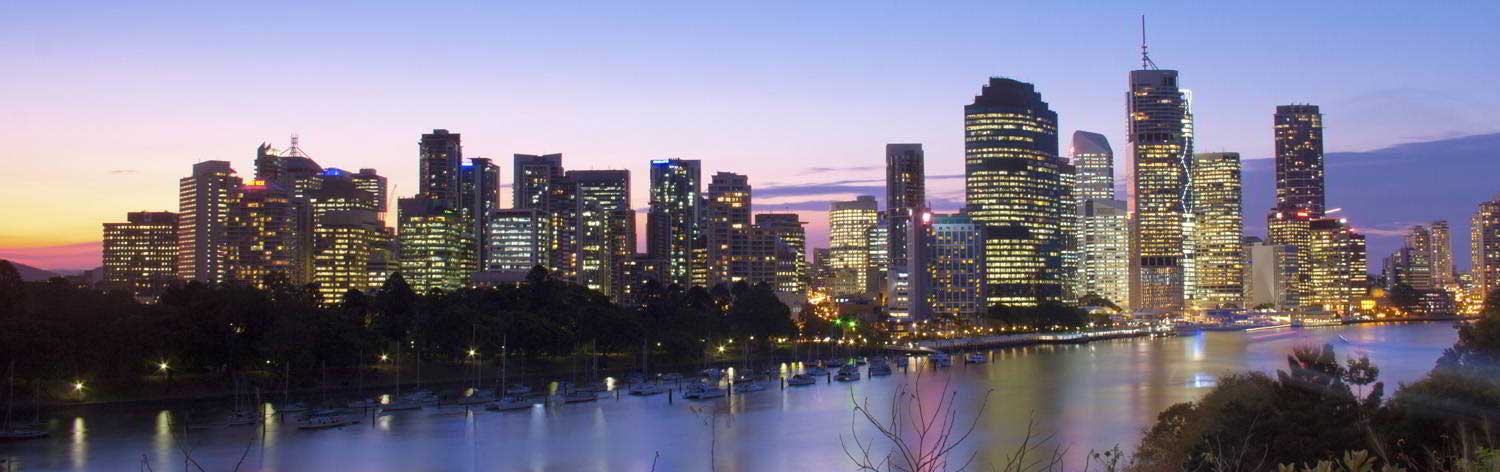 Panoramic view of Brisbane skyline with clear blue skies, showcasing the location for Pool Covers Brisbane.