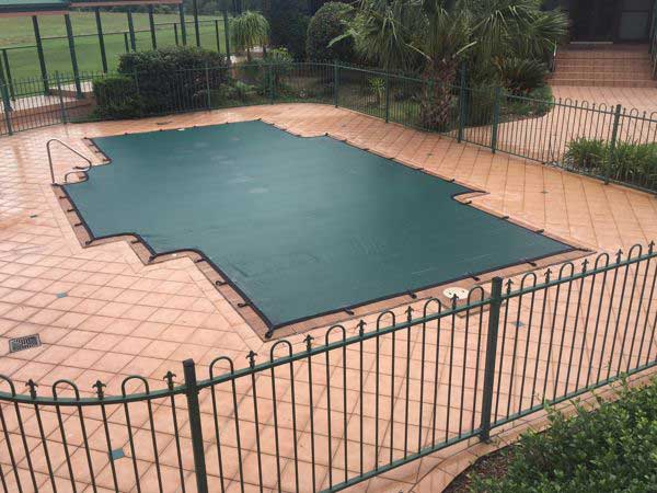 Premium Leaf & Debris Pool Cover installed over a swimming pool in Perth, providing effective protection against falling leaves and debris.